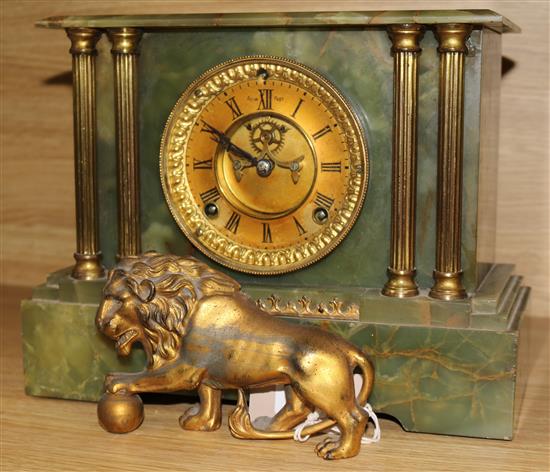 A Victorian lion mounted green onyx mantel clock
